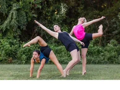 Modern dance group performing outdoors
