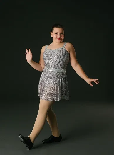 Tap dancer in sequin costume performing